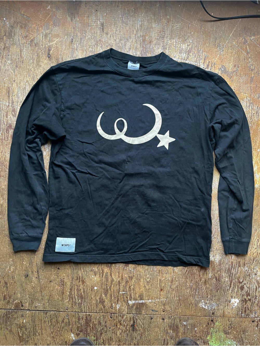 WTAPS Black Long-Sleeve Tee with Crescent and Star Graphic